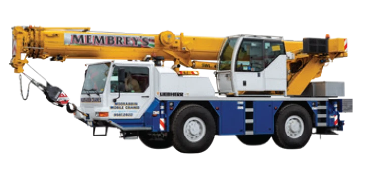 A yellow and blue mobile crane truck with "Membrey's" written on the boom, featuring an operator’s cab and extended crane arm.