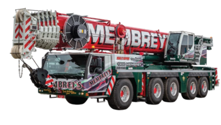 A large mobile crane with eight wheels and "Membrey’s" written on the cab and boom, featuring red, white, and green colors. The crane's boom is extended and rests atop the vehicle.