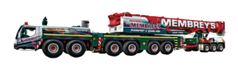 A large, multi-axle mobile crane truck with "Membrey's" written on the extended red crane arm, featuring green and white company branding along the vehicle.
