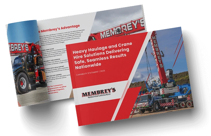 Two brochures titled "Heavy Haulage and Crane Hire Solutions Delivering Safe, Seamless Results Nationwide" with images of large red MEMBREY'S cranes and trucks, and bold red and white text on the covers.
