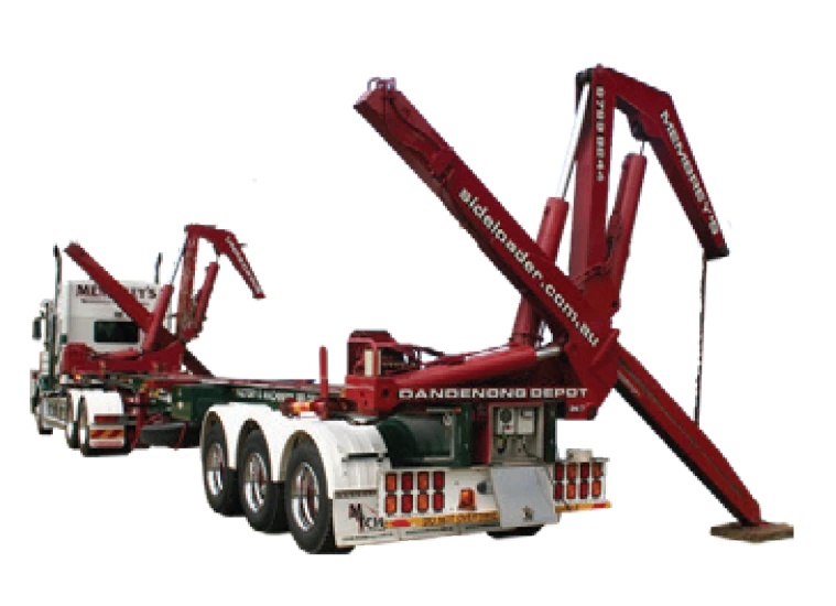 A truck with a specialized trailer equipped with large red hydraulic arms, used for lifting and transporting shipping containers; the arms are raised upright.
